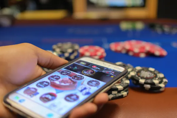A confident dealer surrounded by casino chips inviting players to access their DECO X50 account, reflecting quick and easy login options.